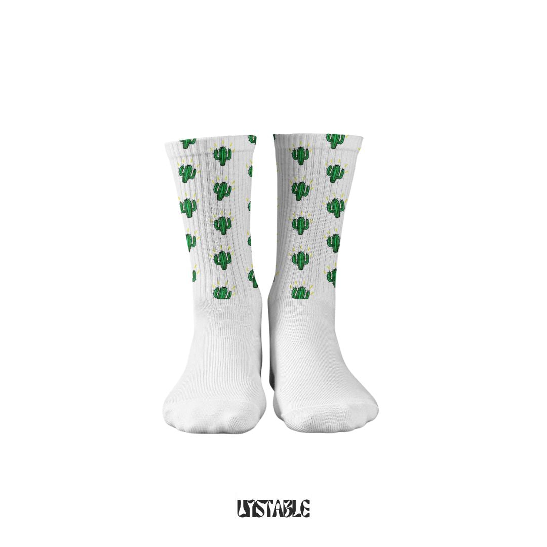 White socks with green cactus pattern on a white background