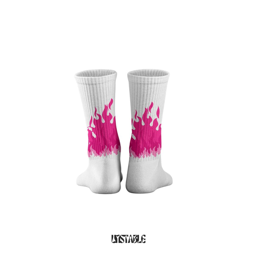 White socks with pink flame design on a white background