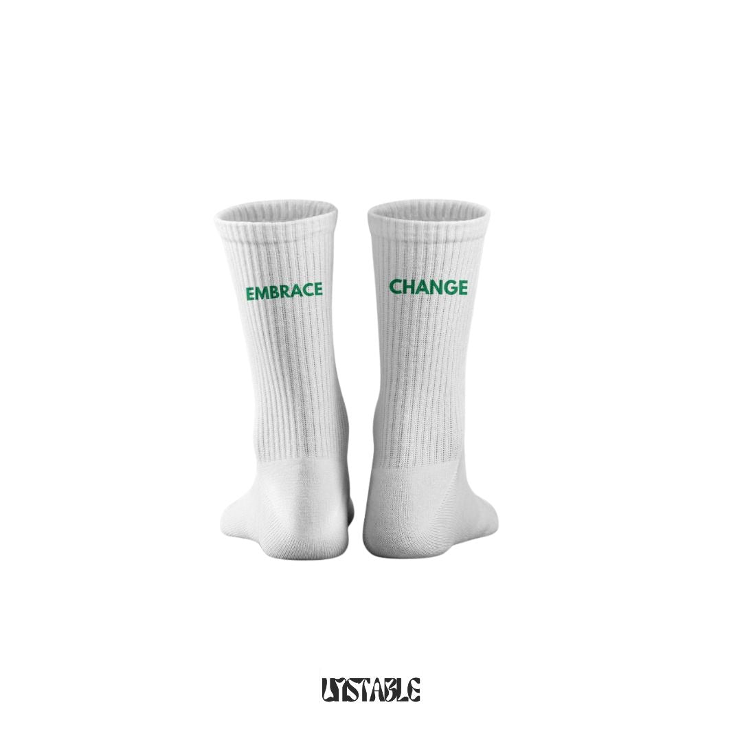 White socks with 'Embrace Change' text on a white background