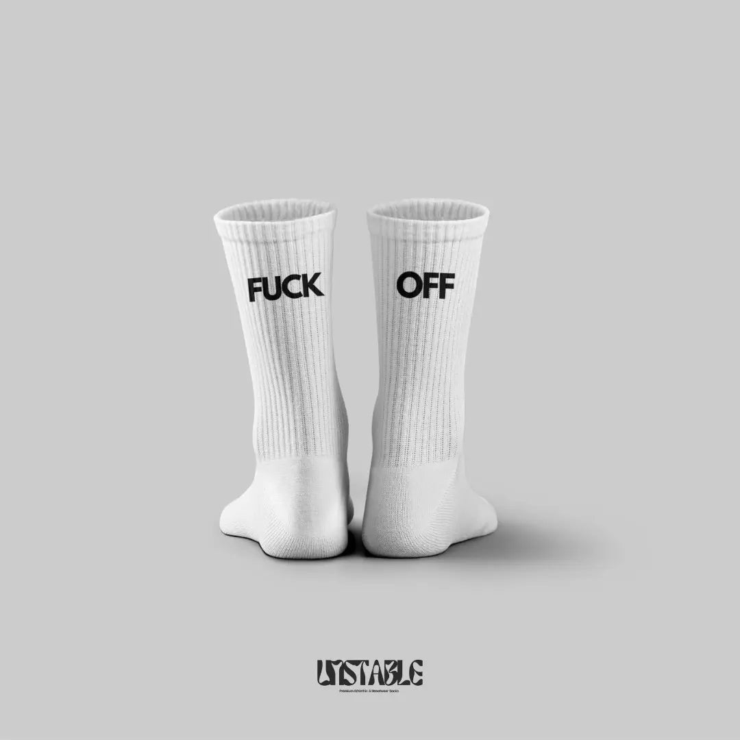 White socks with 'FUCK OFF' text on a gray background, featuring the brand 'UNSTABLE'.